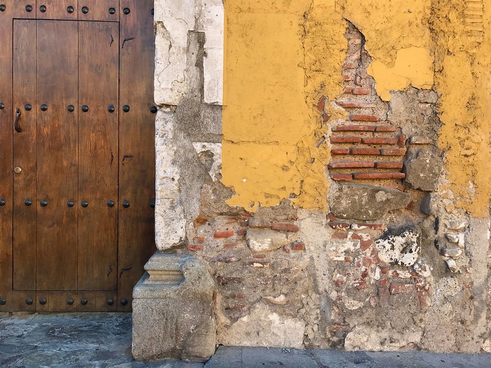 charming yellow and brick building in Antigua, Guatemala
