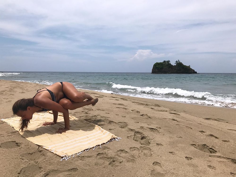 Sapphire &amp; Elm Founder, Stephanie doing some yoga on playa cocles, costa rica