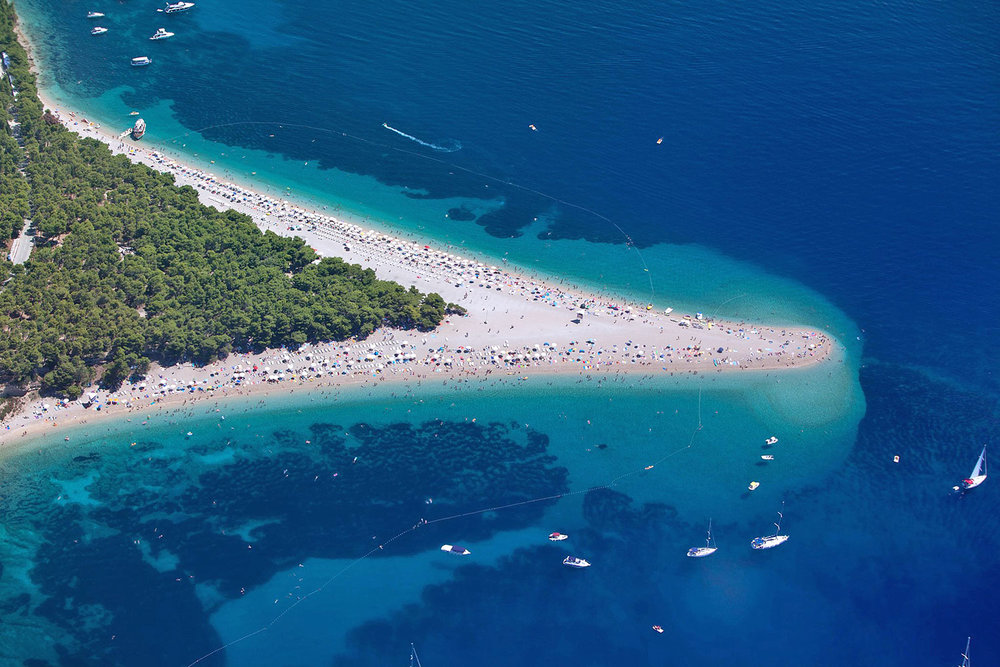 the famous bol beach on brac island, croatia by  Jeroen Komen . photo was brightened up.